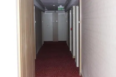 a hallway with a long corridor with a red carpet at KAT11 in Beylikduzu