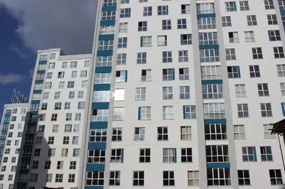 a tall white building with many windows at KAT11 in Beylikduzu