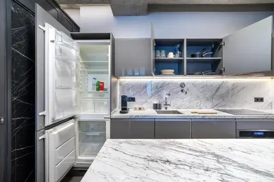 a kitchen with a marble counter top and a refrigerator at RA Apartments in Istanbul
