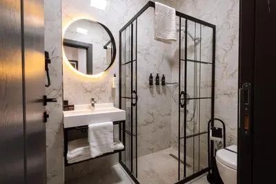 a bathroom with a sink and a shower at Meyzi Hotel in Istanbul
