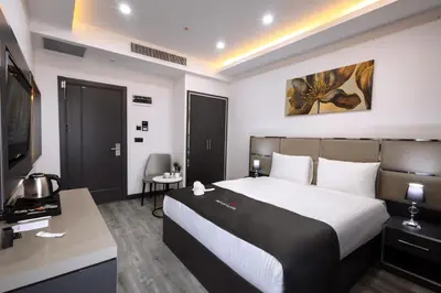 a hotel room with a bed and a television at Meyzi Hotel in Istanbul