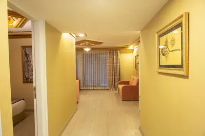 a hallway of a room with a living room at Empire Suite Hotel in Istanbul