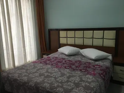 a bedroom with a bed with two pillows at Konak Apart Hotel in Istanbul