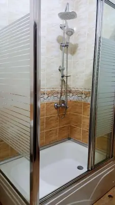 a shower with a glass door in a bathroom at Konak Apart Hotel in Istanbul
