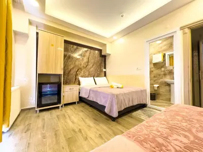 a hotel room with a bed and a television at Öz Dünya Hotel in Istanbul