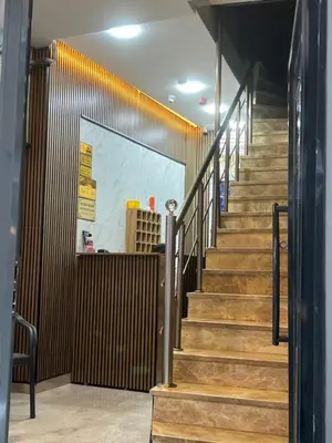 a stairway in a building with wooden stairs at Öz Dünya Hotel in Istanbul