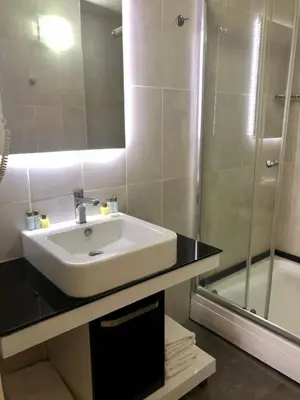 a bathroom with a sink and a shower at Era Palace Hotel in Istanbul
