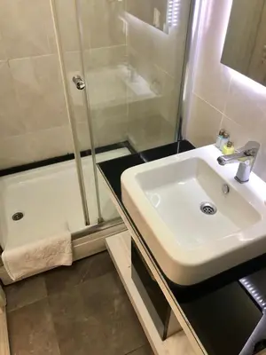 a bathroom with a sink and a shower at Era Palace Hotel in Istanbul