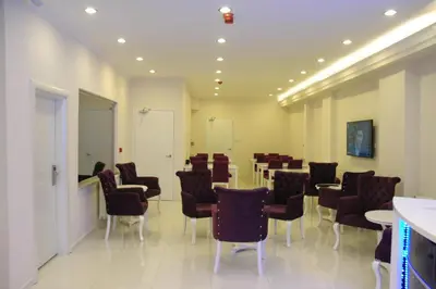 a conference room with chairs and tables in it at Hotel Iscen in Mustafakemalpaşa