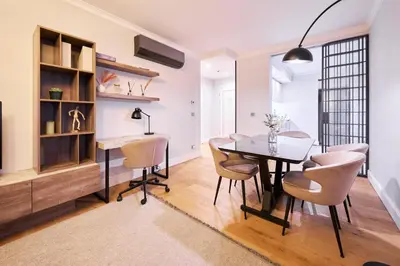 a dining room with a table and chairs at Taksim Lagirio Residence in Istanbul