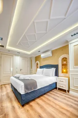 a bedroom with a large bed and a white ceiling at Mahhsen Mansion Oldcity in Istanbul