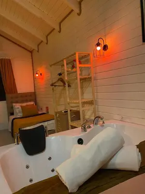 a bathroom with a bath tub with a towel at BungalovCity in Sapanca