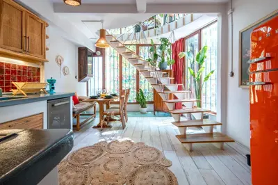 a kitchen with a spiral staircase in a room at Boheme House with Bathtub & Terrace in Istanbul