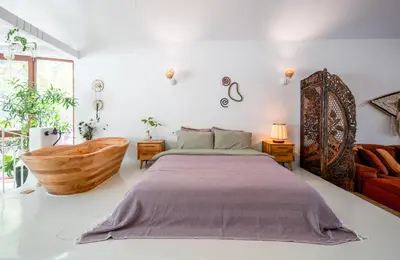 a bedroom with a bed and a wooden tub at Boheme House with Bathtub & Terrace in Istanbul