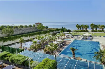 an aerial view of a resort with a pool and the ocean at Hyatt Regency Istanbul Atakoy in Istanbul