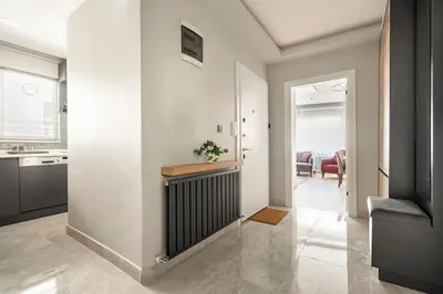 a hallway with a kitchen and a living room at Tomtom HOUSE Centre Location in Istanbul