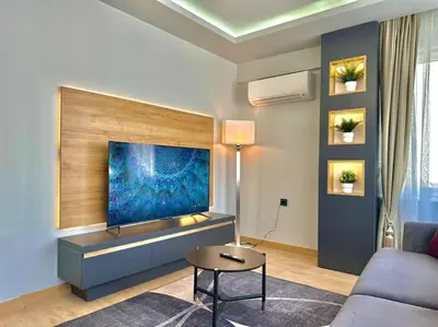 a living room with a large painting on the wall at Tomtom HOUSE Centre Location in Istanbul