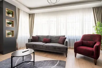 a living room with a couch and a chair at Tomtom HOUSE Centre Location in Istanbul