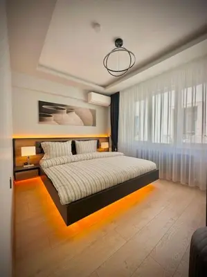 a bedroom with a large bed with lights on the floor at Tomtom HOUSE Centre Location in Istanbul