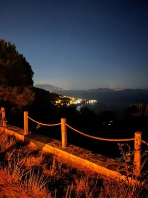 a fence on top of a hill with a view at MOLA villas&suites in Marmara
