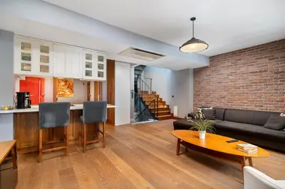 a living room with a couch and a table at Urban Quarters - Asmalı Mescit in Istanbul