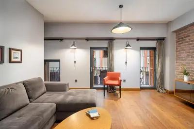 a living room with a couch and a table at Urban Quarters - Asmalı Mescit in Istanbul