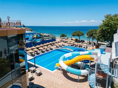 a swimming pool with a water slide at a resort at Avsa Artemis Hotel in Avsa Adasi