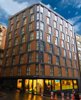 a building on a street with orange cones in front at Bird Nest Suites in Istanbul