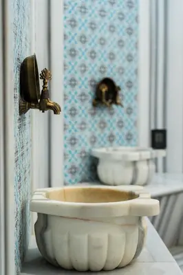 a white bowl sitting on a counter with a telephone at Riva Hotel Nişantaşı in Istanbul