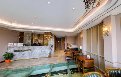 a restaurant with tables and chairs and a counter at Theodosius Hotel in Istanbul