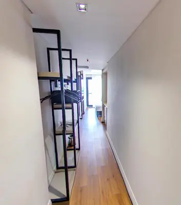 a hallway with shelves in a room with a wooden floor at Theodosius Hotel in Istanbul