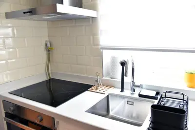 a kitchen with a sink and a counter top at İstanbul Guesthouse in Istanbul