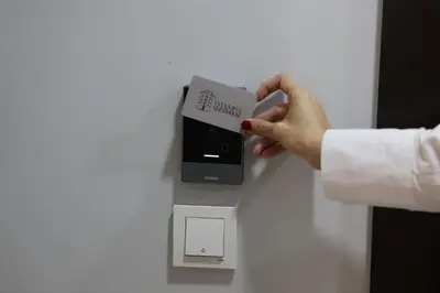 a person is holding a card in a box at İstanbul Guesthouse in Istanbul