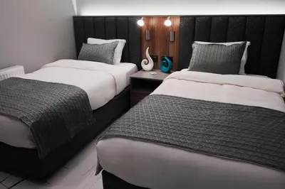 two beds in a hotel room with at No25 Suites Nisantasi in Istanbul