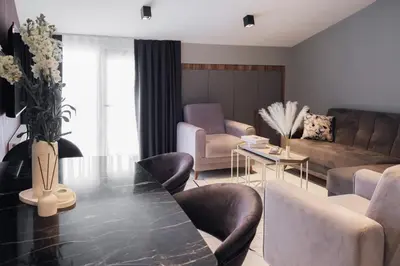 a living room with a black table and chairs at No25 Suites Nisantasi in Istanbul