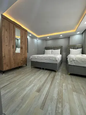 a room with two beds and a mirror at IMMOR AKKUS HOTEL in Istanbul
