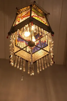 a chandelier hanging from a ceiling with lights at NİA SULTANAHMET in Istanbul