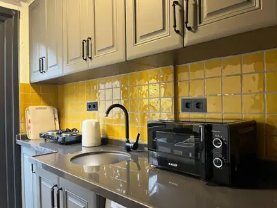 a kitchen with a sink and a microwave at Casa Mirasol Terrace Golden Horn Istanbul in Istanbul
