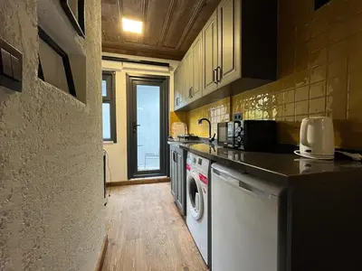 a kitchen with a washer and dryer in it at Casa Mirasol Terrace Golden Horn Istanbul in Istanbul
