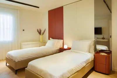 two beds in a hotel room with at G Residences Gayrettepe in Istanbul