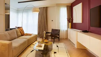 a living room with a couch and a table at G Residences Gayrettepe in Istanbul
