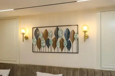 a wall with a picture of feathers on it at Safa Hotel Old City in Istanbul