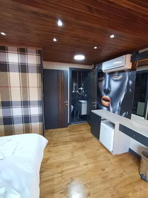 a bedroom with a wall with a picture of a woman at Bonita Boutique in Istanbul