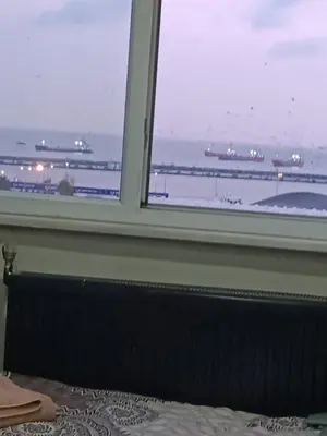 a window in a bedroom looking out at an airport at Suite Hotel in Istanbul