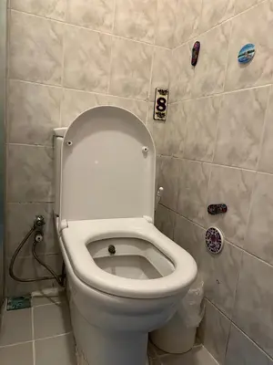 a bathroom with a toilet with the lid up at Sea view House in Istanbul
