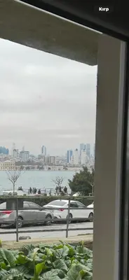 a window view of cars parked in a parking lot at Sea view House in Istanbul