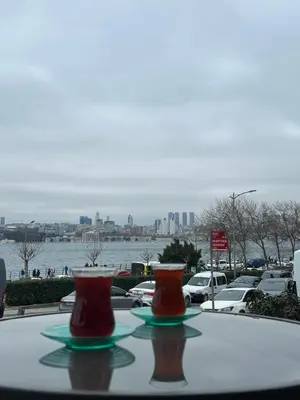 two vases sitting on a table in front of a parking lot at Sea view House in Istanbul