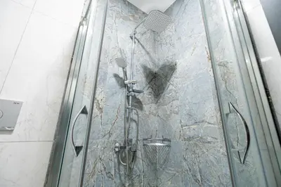 a shower in a bathroom with a glass wall at Mysia Olympos Hotel in Bursa