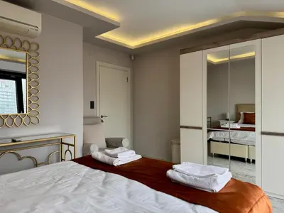 a bedroom with a bed with two towels on it at Bomonti 42 Suites in Istanbul