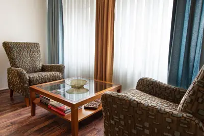 a living room with two chairs and a coffee table at An Unforgettable Experience in Istanbul